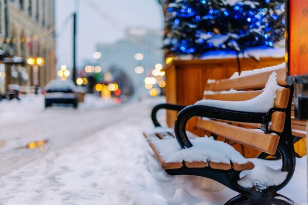 Winter bench strewn with snow