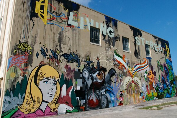 A building with multicolored graffiti depicted on it