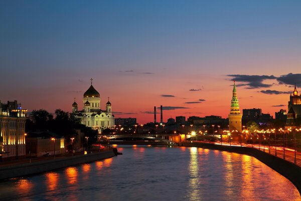 The city of Moscow, the Cathedral of Christ the Savior on the background of the sunset sky and the Moskva River