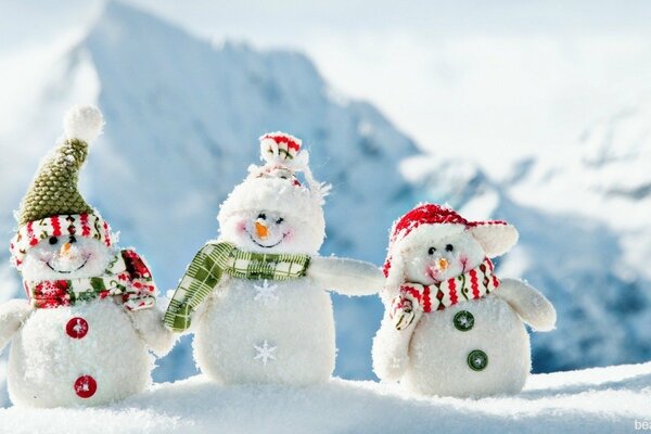 Three snowmen in funny hats