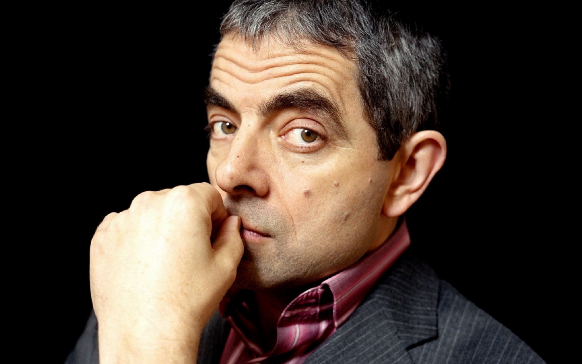 hand rowan atkinson face