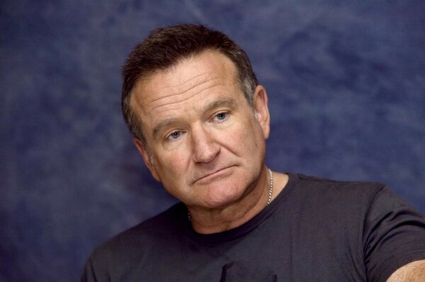 Robin Williams on a blue background