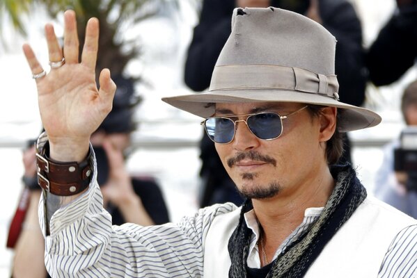 Actor Johnny Depp in glasses and hat