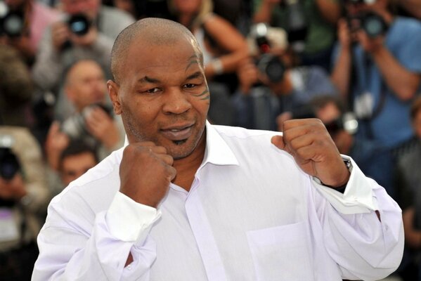 Boxer Mike Tyson in a white shirt