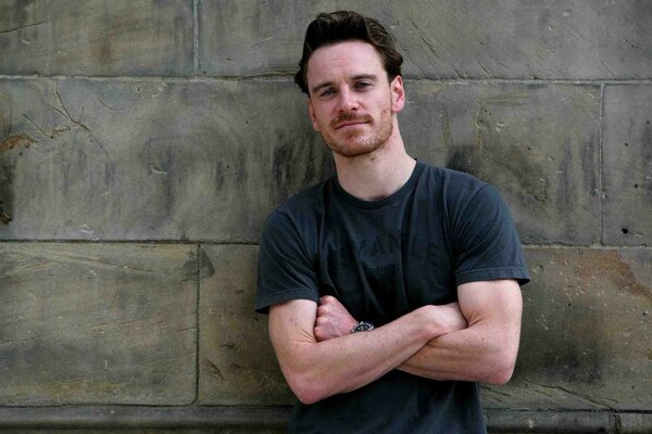 Michael Fassbender against the wall