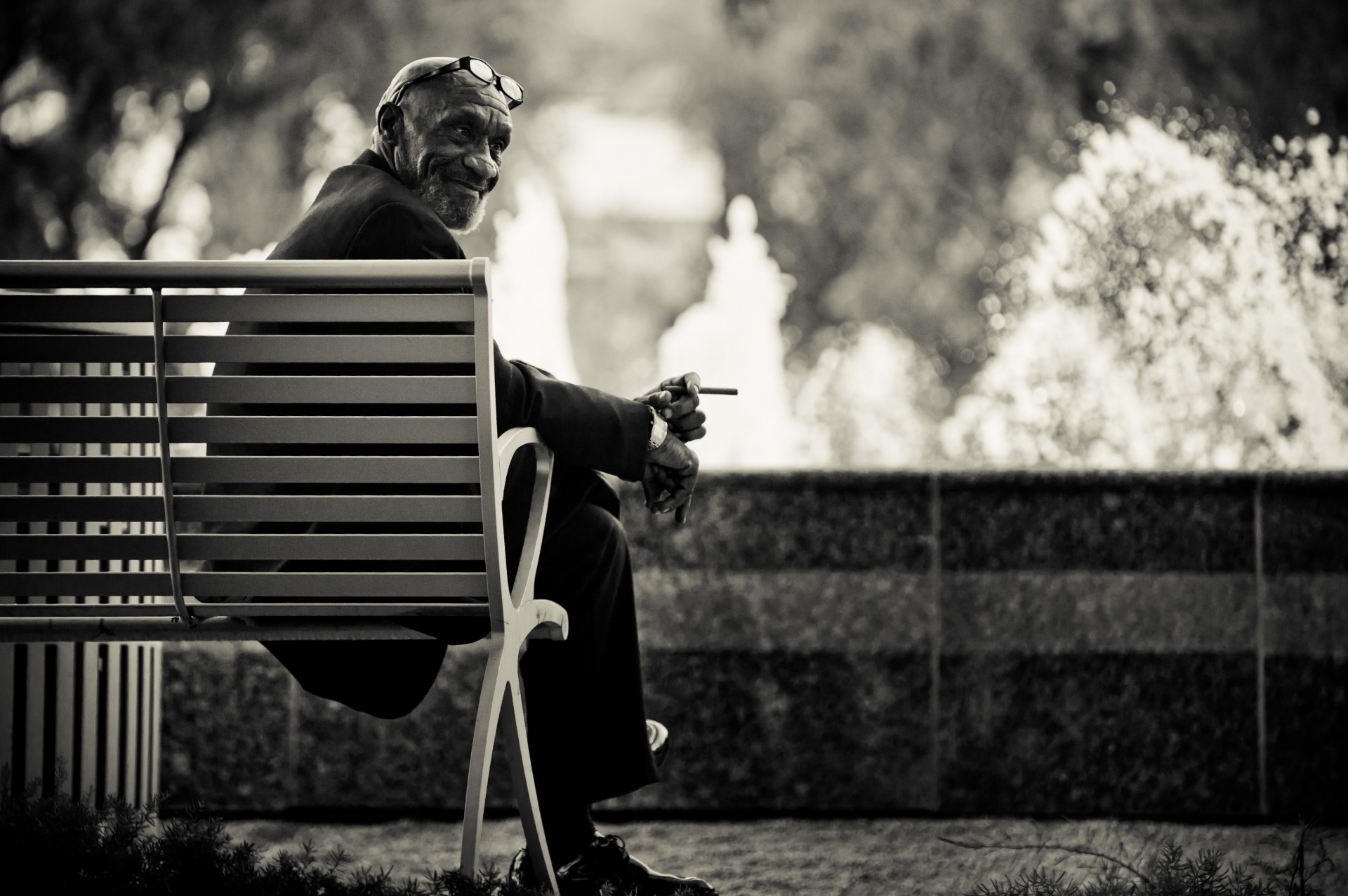 man bench sunglasse