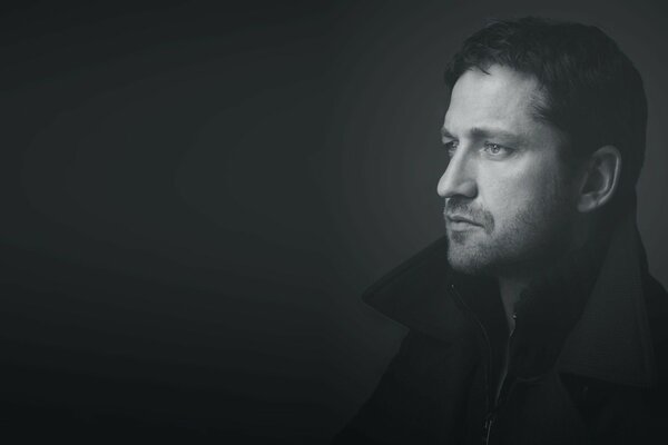 Photo of Gerard Butler in a black coat