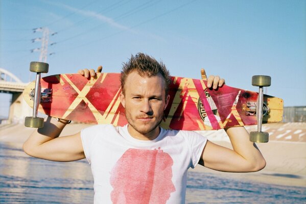 Actor Heath Ledger with a skate