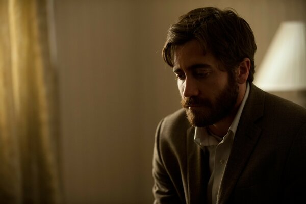 Actor with a beard on a dark background