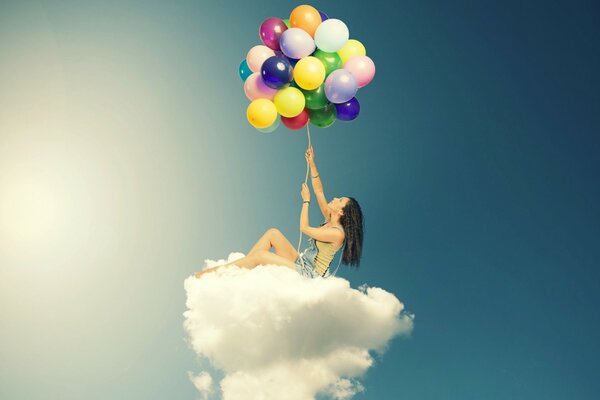 Chica en la nube con globos