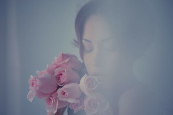 Tender photo of a girl with a bouquet of flowers