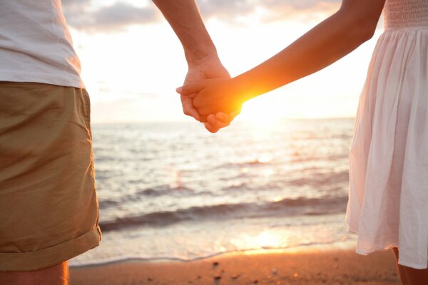 Couple on the shore of the gentle sea