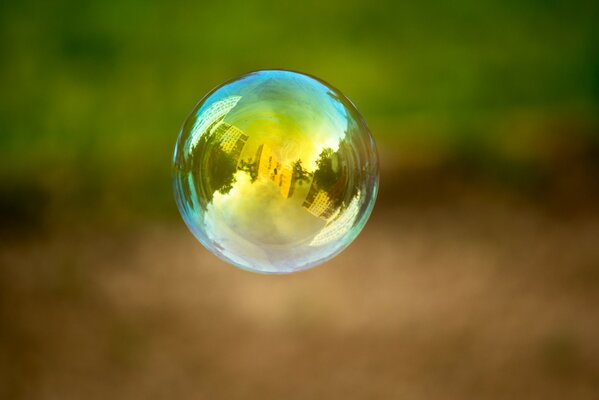 A soap bubble displaying a blurry city