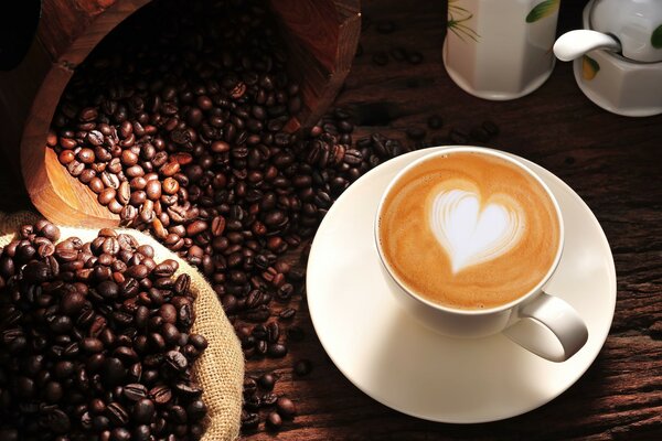 Still life with a cup of coffee and coffee beans