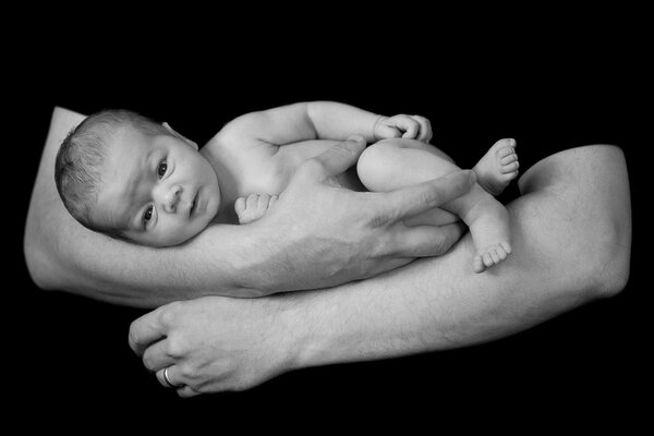 Baby in arms black and white