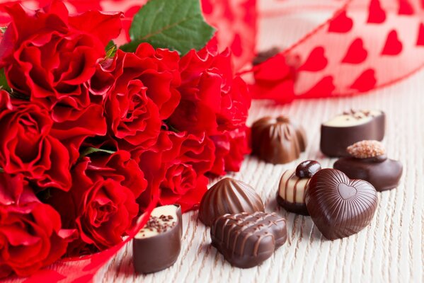 Chocolats avec bouquet de roses rouges