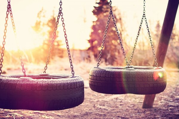 Swing with chain and wheels in nature