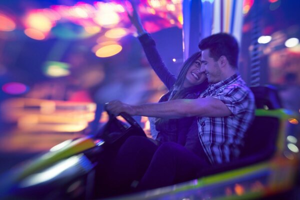 Happy couple in the evening at the attractions