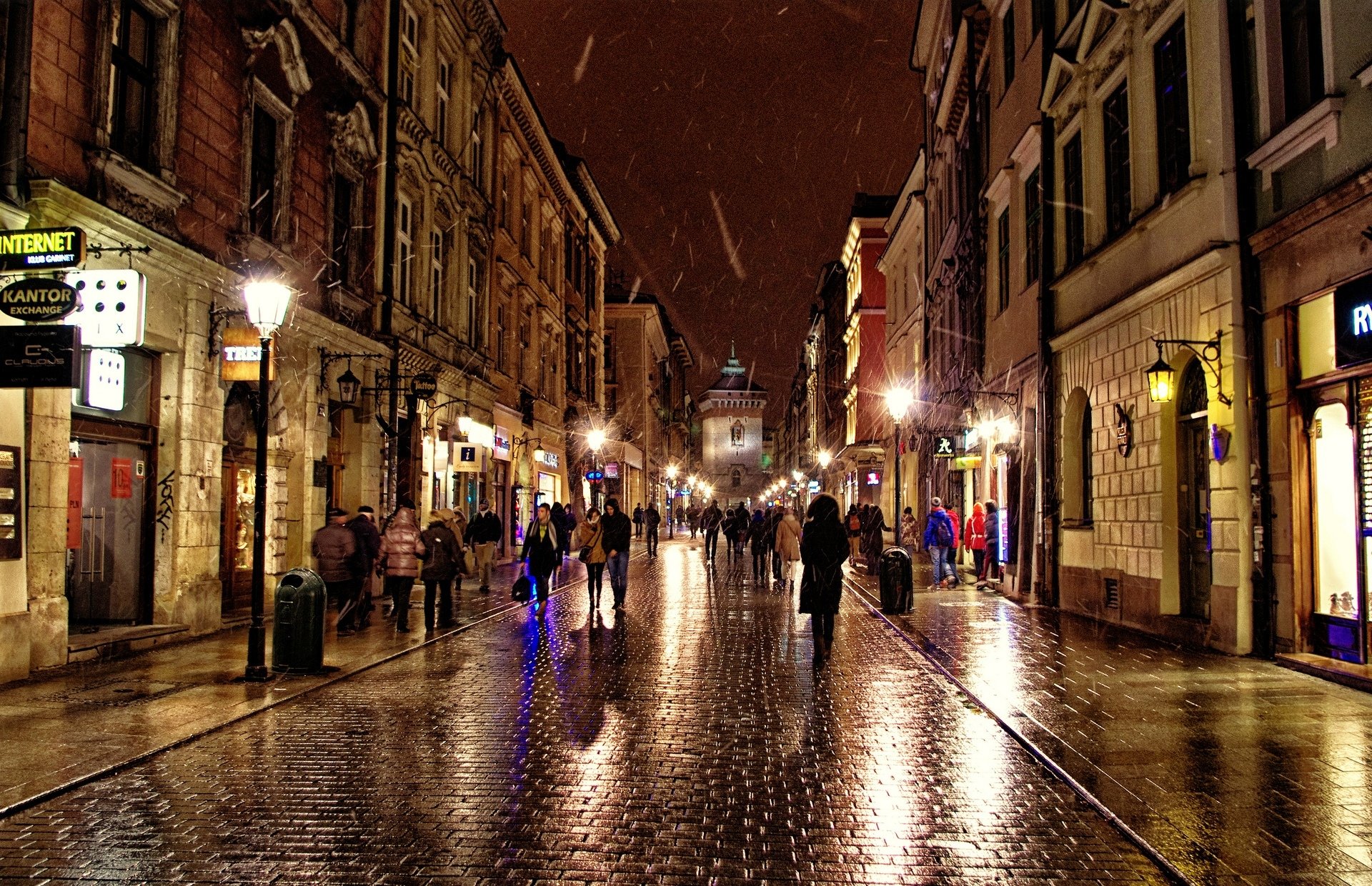 polska krakow poland street town night rain people house shops lighting