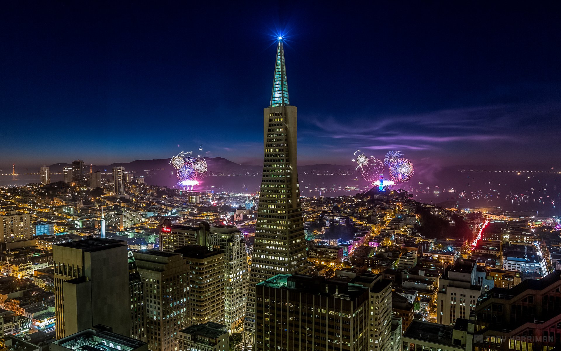 an francisco california usa night city lights lighting blue sky skyscrapers buildings houses holiday fireworks firework