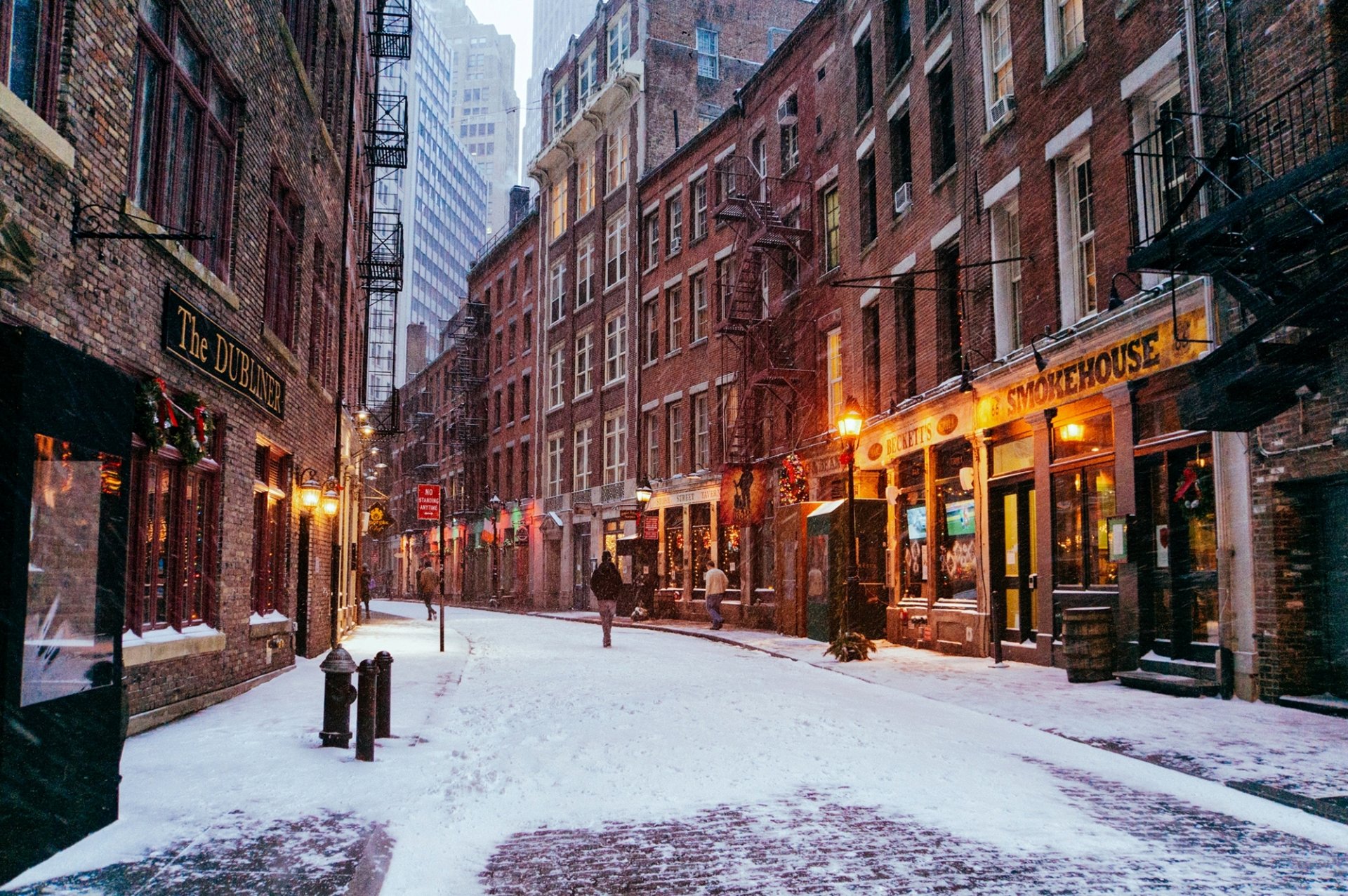 new york manhattan financial district usa city street road shops buildings houses windows people passers-by winter snow