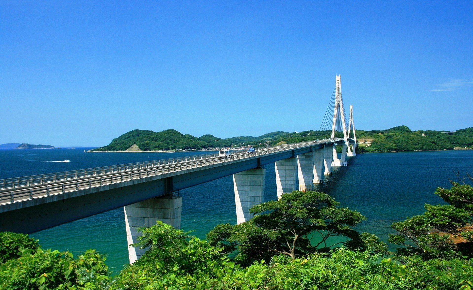 ciudad país puente río vegetación plantas naturaleza árboles azul mar dal montañas cielo