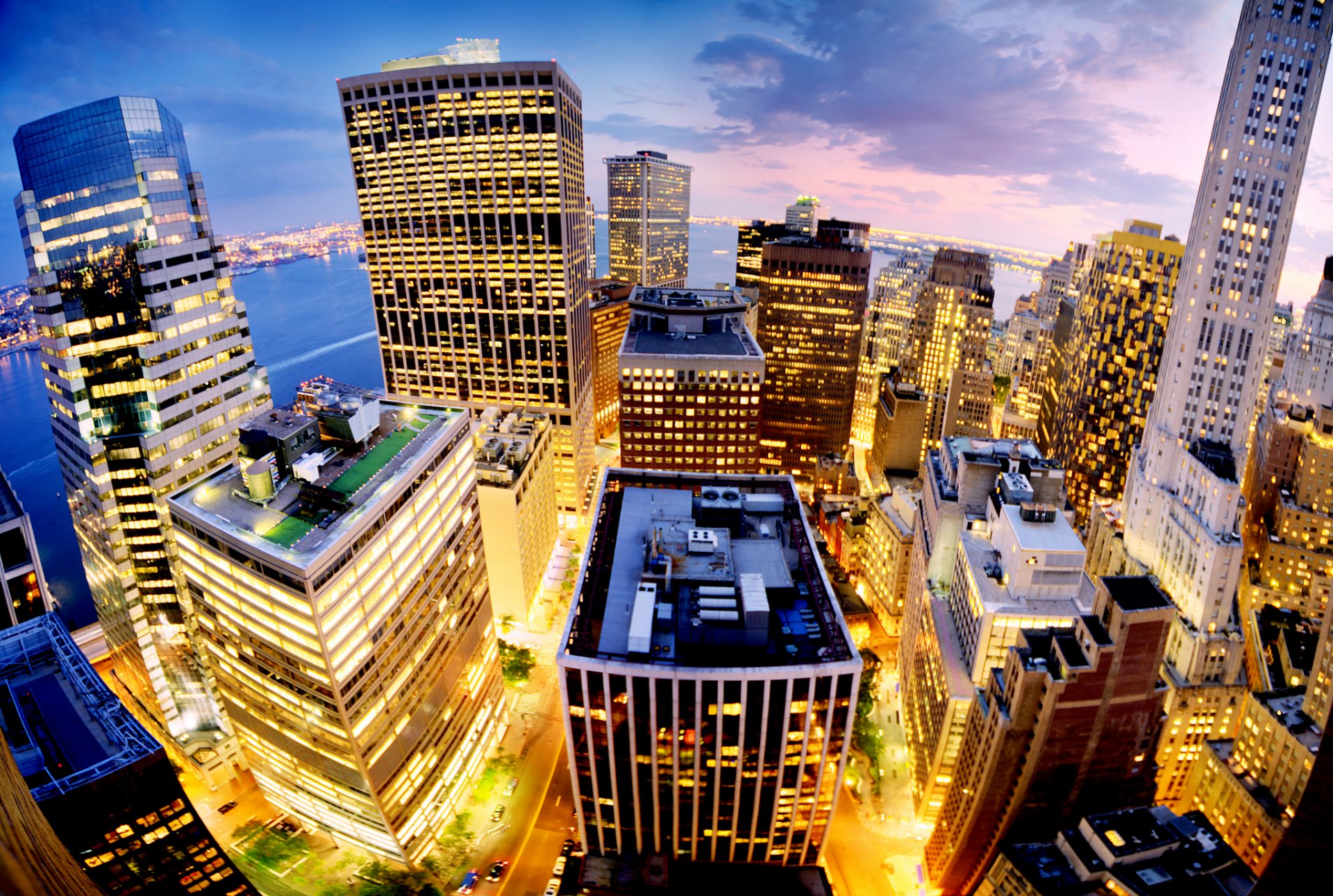 new york manhattan usa city view height panorama evening pink sunset blue sky clouds lights light houses buildings skyscrapers skyscraper