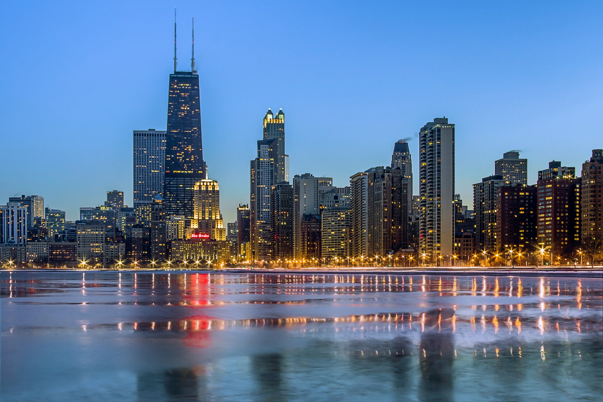 chicago miasto wieczór światła drapacze chmur ocean zima