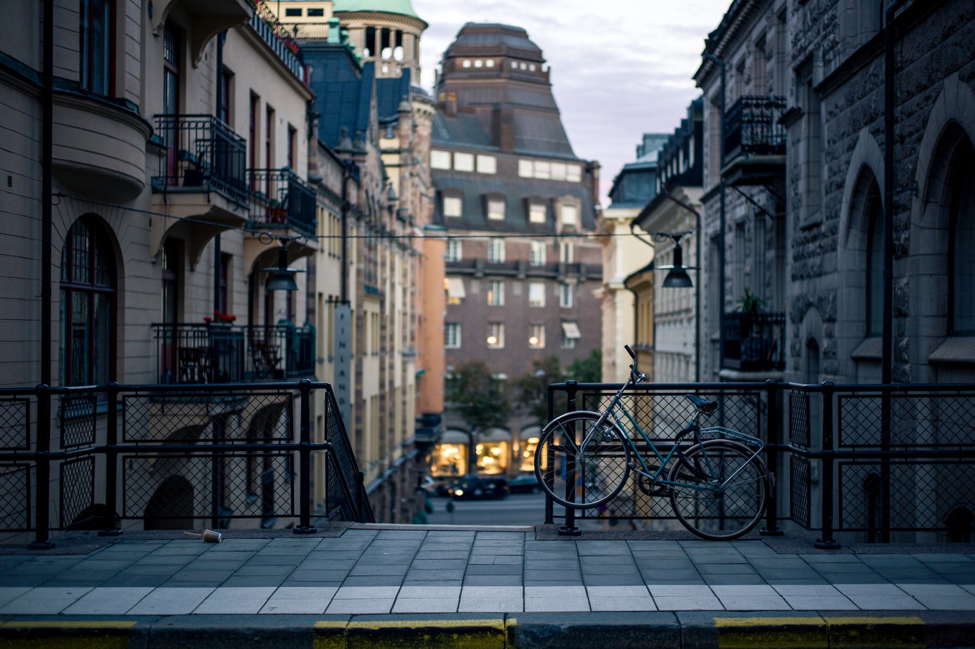 tockholm sweden evening city street houses buildings sidewalk curb bicycle