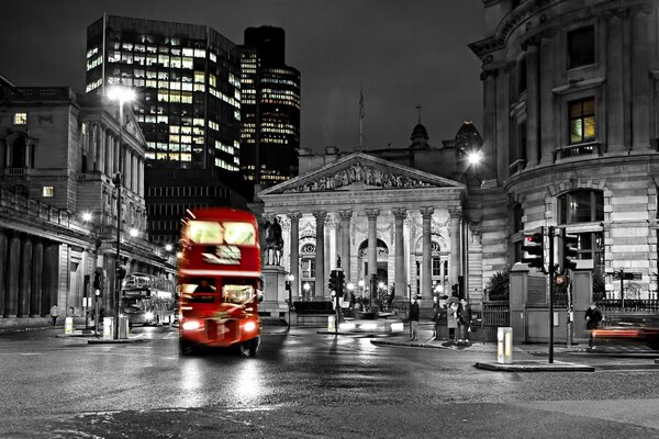 London. A blurry bus on the night streets of the city