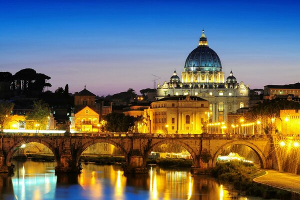 The Bridge of the Holy Angel in the bright light of street lamps