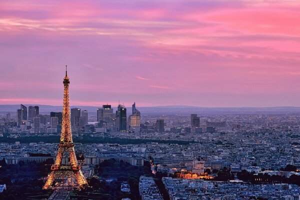 Eiffel Tower in Paris on the background of a pink sunset