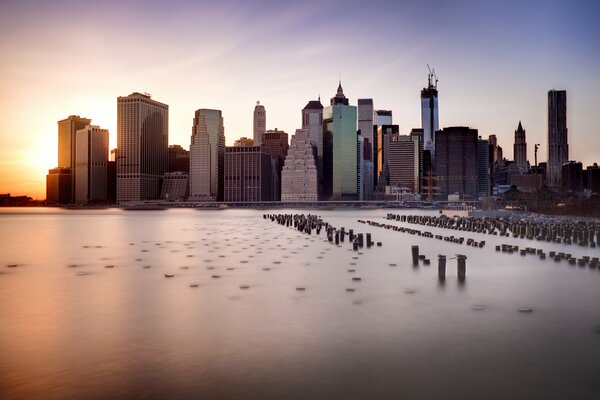 Evening embankment with New York skyscrapers