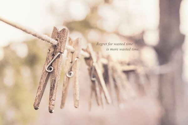 Wooden clothespins on a rope