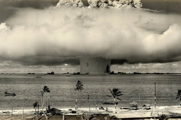 Plumes of smoke from the blast wave near the beach