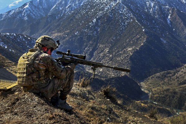 A military officer aims at the enemy