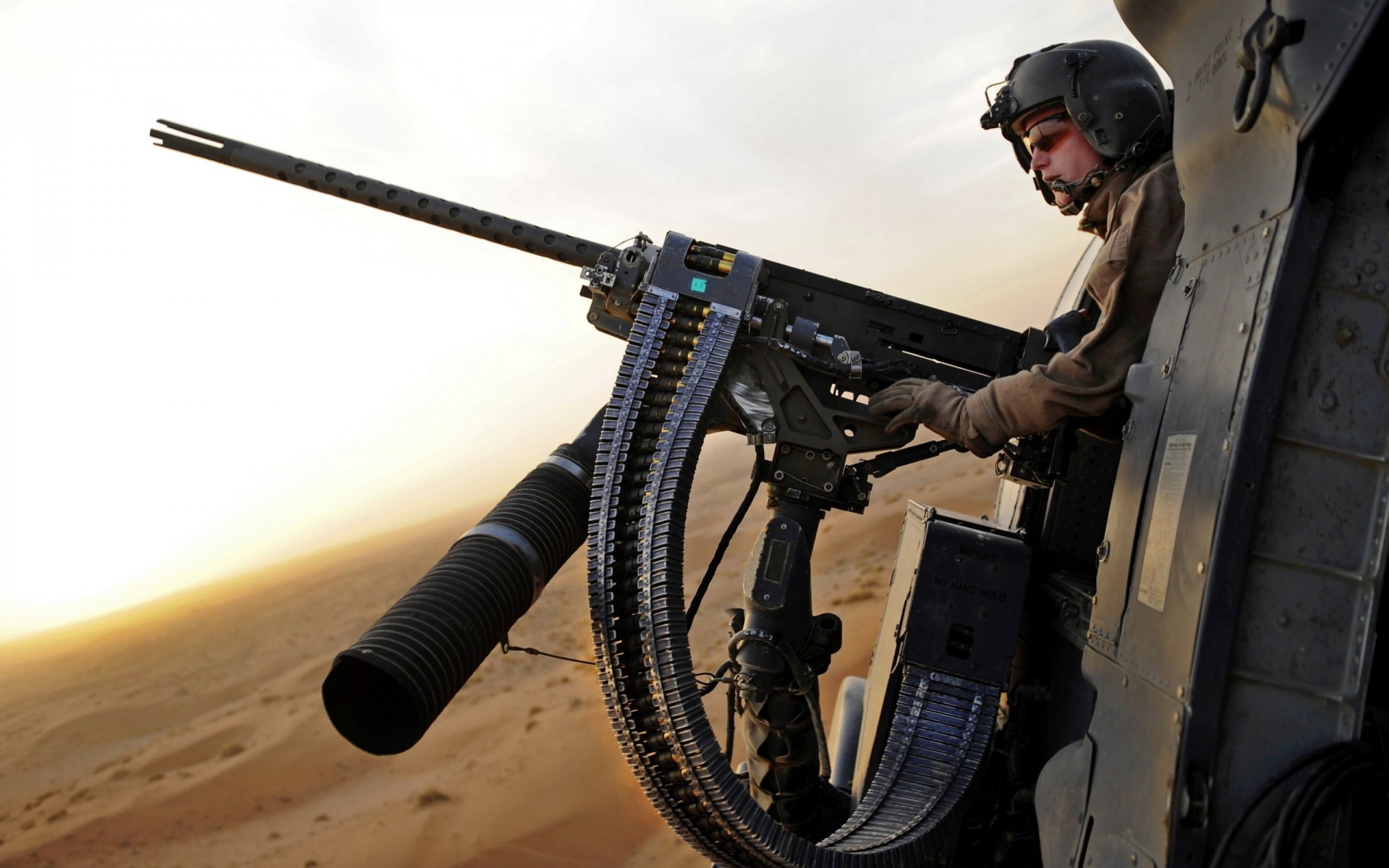 helmet shooter belt desert machine gun