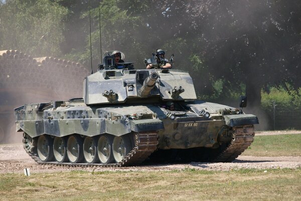 Tank in a field with a British flag