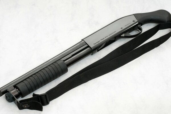 Black shotgun on a gray background