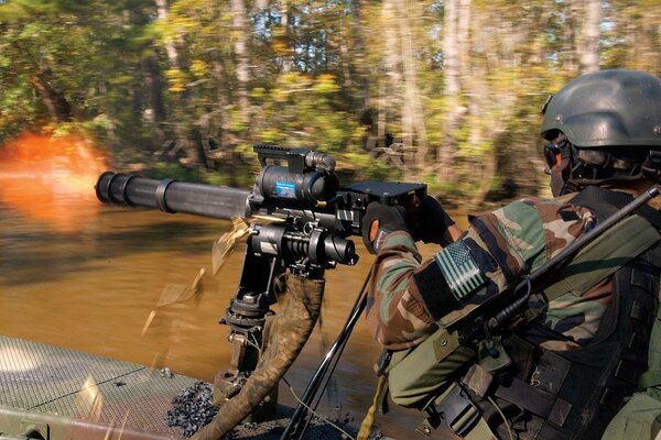 A soldier shoots fire at a tree