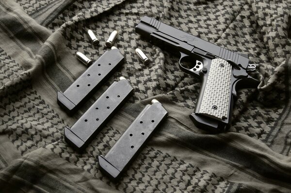 Black pistol 1911 on a dark background