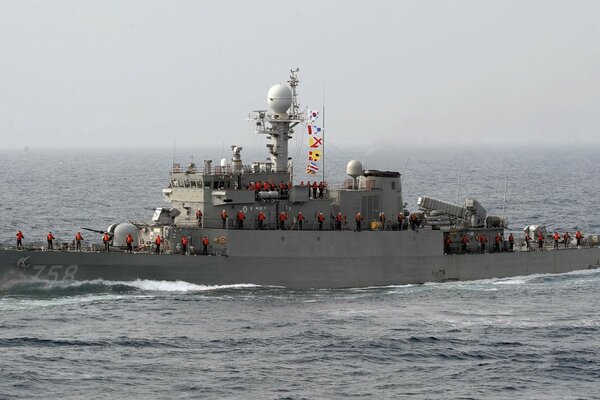 A warship floats on the water