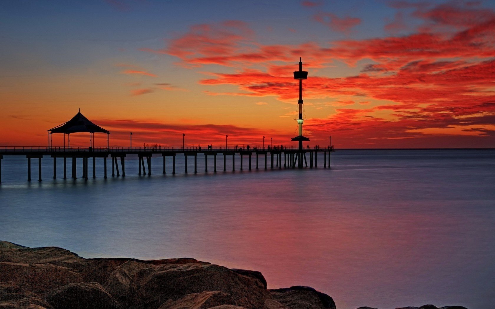 paisaje mar puente puesta de sol