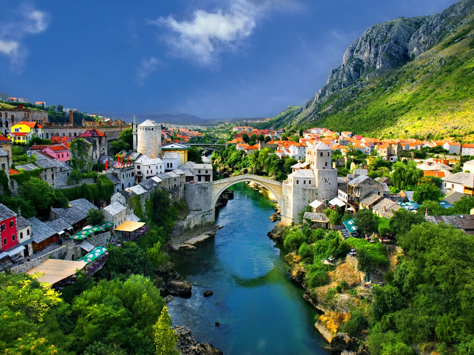 alpine town mountain house bridge river tree nature landscape