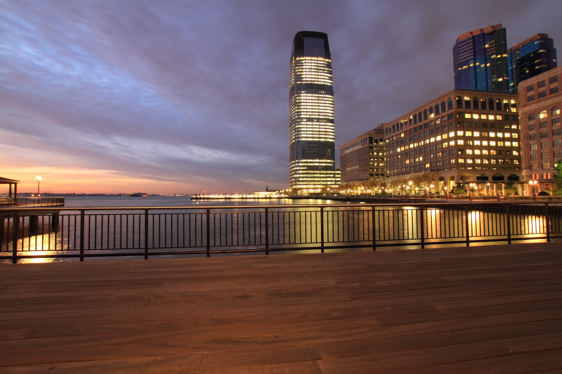 usa jersey city new jersey new jersey evening orange sunset sky clouds clouds skyscrapers illumination lights embankment river hudson