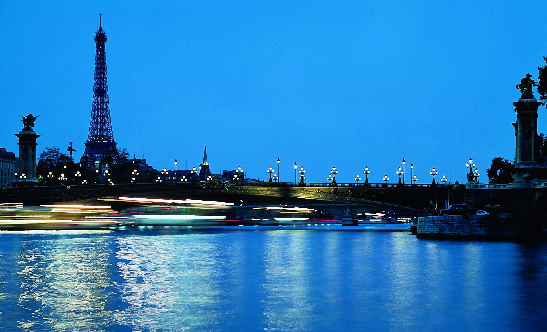 paris france eiffel tower bridge water blue sky night lights night city lamp