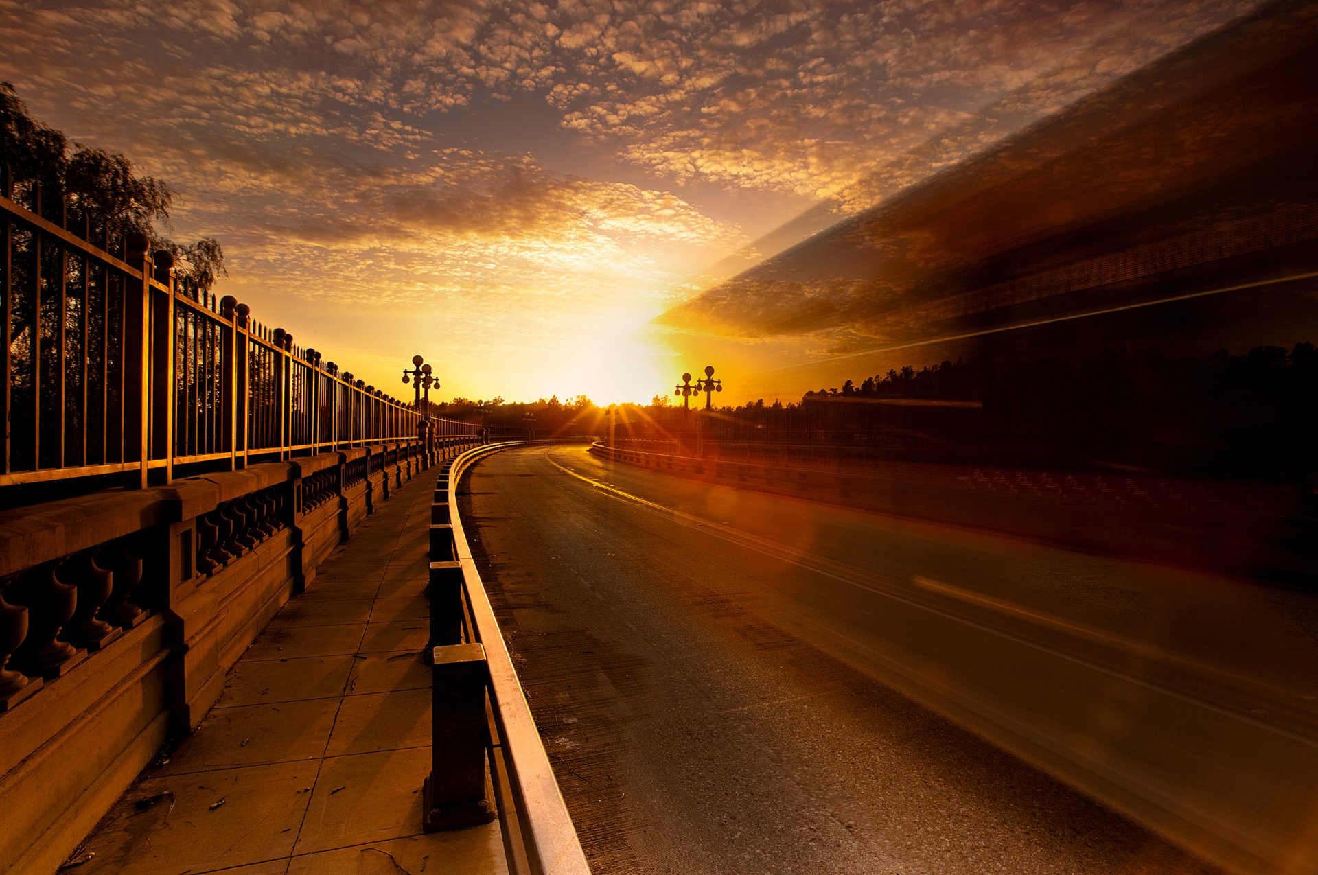 town road fence sky sun light extract reflection