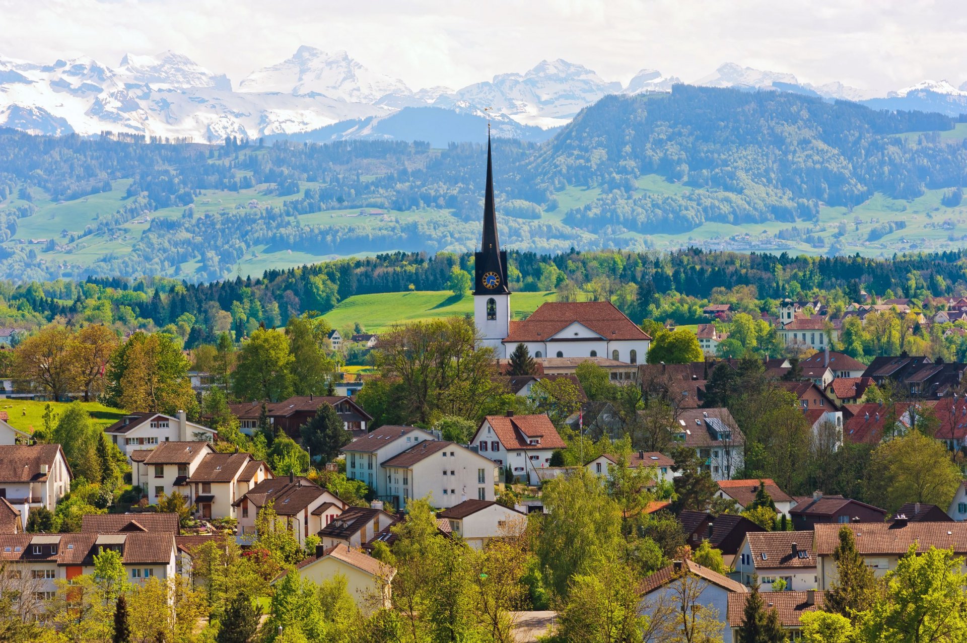 gossau schweiz berge kirche gebäude häuser bäume panorama