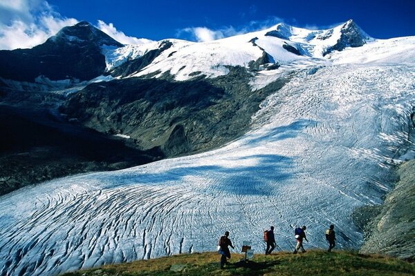 Snowy Alps climbing tourists