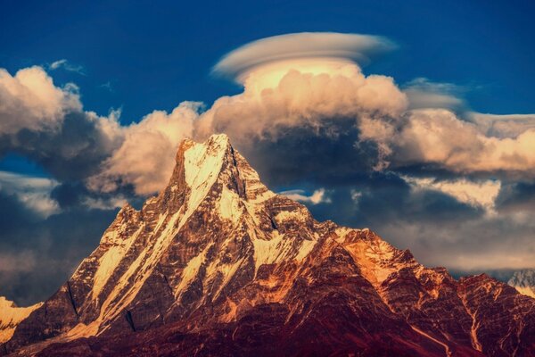 Mountains with snow and clouds over the mountains